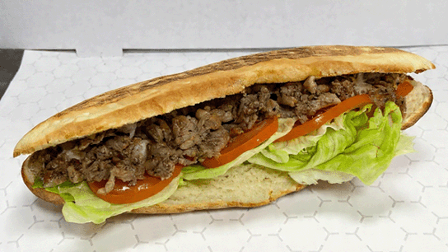 Freshly baked bread with seasoned meat and vegetables