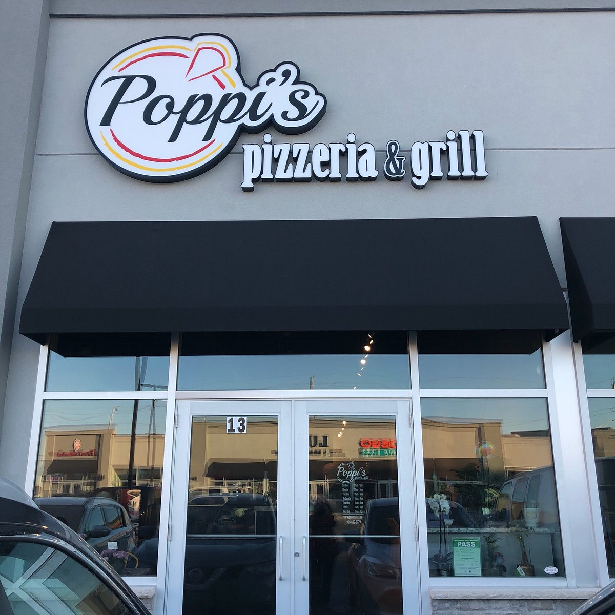 Poppi’s Pizzeria & Grill storefront sign